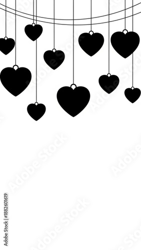Hanging black hearts on strings in minimalist design  