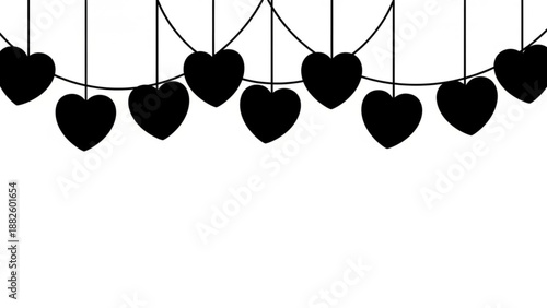 Black hearts hanging on strings against a white background  
