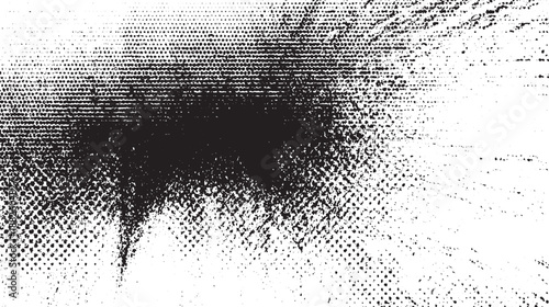 Abstract black and white texture with a dense halftone dot pattern and a central dark spray paint effect for a dynamic grunge background
