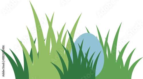 Easter egg hidden in green grass blades.