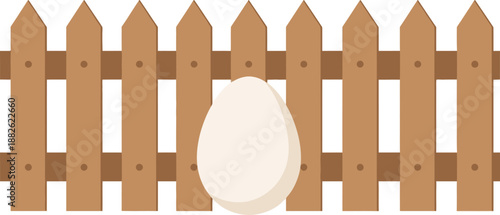 A white egg behind a brown wooden fence.