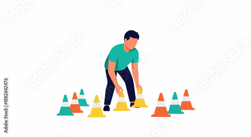 Man arranging cones for agility training