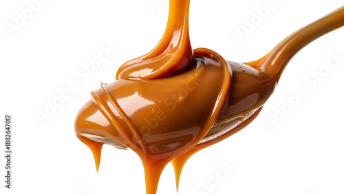 Golden caramel sauce gracefully flowing onto a gleaming spoon, creating luscious drips against a pristine white background, highlighting a