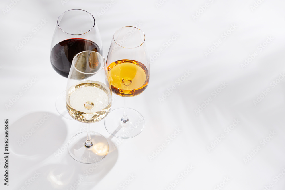 Obraz premium Different wine glasses on white background
