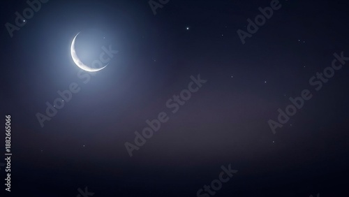 Crescent moon in a dark sky speckled with scattered stars