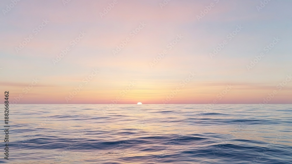 Fototapeta premium Ocean sunset with gentle waves pale sky sun just above horizon