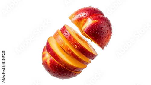 A beautifully segmented red and golden nectarine, vibrant and dewy, showcasing its refreshing juiciness and natural allure on a spotless white