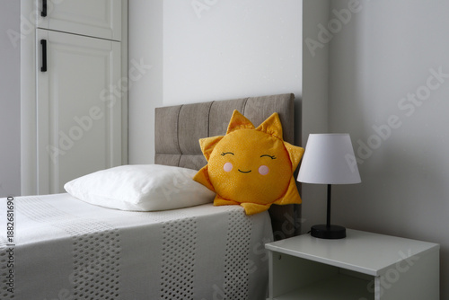 Children's bedroom, yellow sun cushion