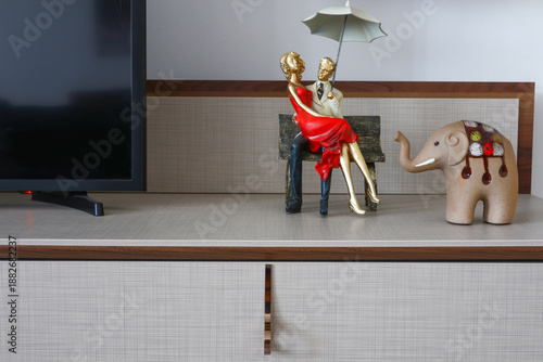 lovely decorative object sitting on a bench, elephant decorative object