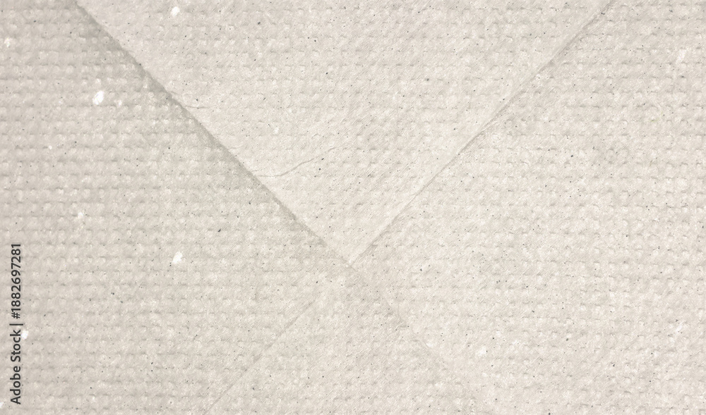 Fototapeta premium Dotted beige halftone background. Light cream pixelated paper texture. Retro craft taupe wallpaper. Grunge grainy gradient overlay. Weathered dirty canvas material backdrop.