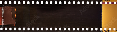 Vintage 35mm film strip border with sprocket holes and light leak texture