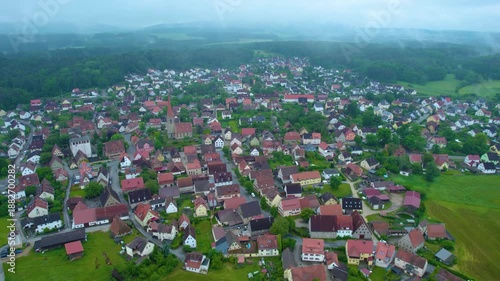 A panorama aerial view of the city Ottensoos on a cloudy early morning in spring