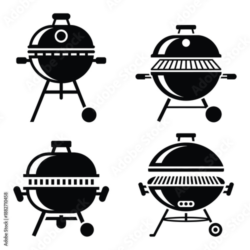Four black and white barbecue grills with open lids