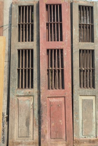 Canvastavla Three Vintage Weathered Wooden Doors With Iron Bars