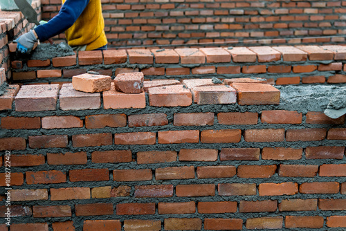 Close up of bricklayer building walls