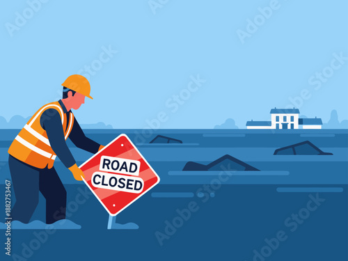 A construction worker places a 'Road Closed' flood sign during a flood. The scene depicts water and a damaged building in the background.  Clear, impactful image.