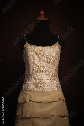 Spaghetti strap dress with ruffle tier on a mannequin display