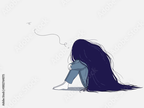 Sad young woman sitting alone with her head down feeling depressed