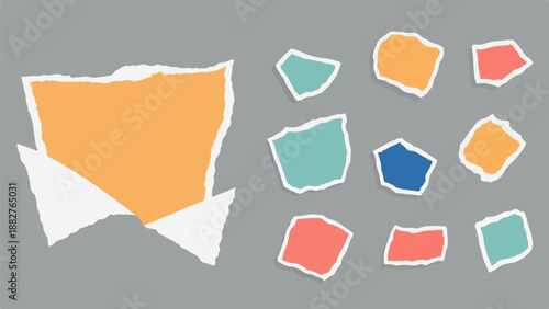 Colorful torn paper scraps scattered on a grey background