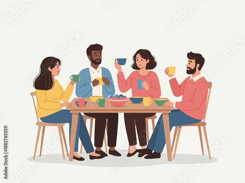 Group of friends sitting around a table eating and drinking together
