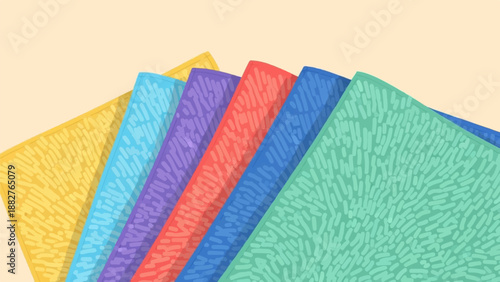 Colorful textured cloths arranged in a fan shape on a light cream background