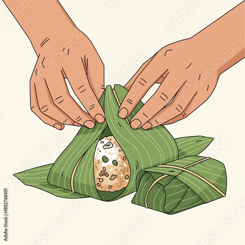 Hands wrapping rice in green leaves for cooking
