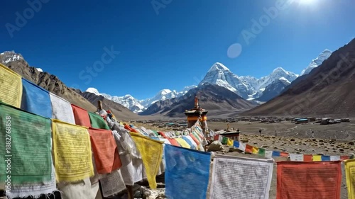 Scenic view of prayer flags and mountains in a high altitude landscape on a sunny day