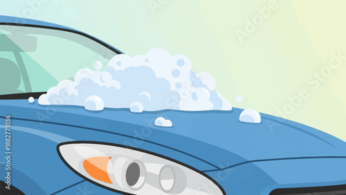 Blue car hood covered in bubbly white soap with a soft yellow sky