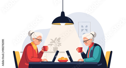 Two elderly women sit comfortably at a table in a modern kitchen, working on their laptop computers while enjoying a warm cup of coffee together.