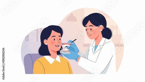 Dentist showing a patient a dental model for oral hygiene