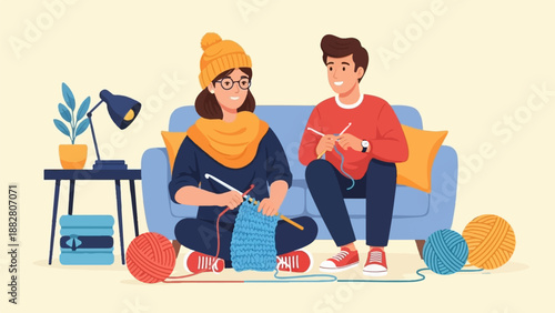 Couple knitting together on a couch with yarn and a lamp