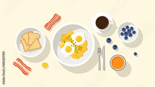 Breakfast Delight: A Colorful Array of Eggs, Bacon, Toast, Berries, and Coffee