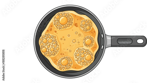 Overhead view of golden pancake batter actively bubbling in a non-stick frying pan, perfectly illustrating the morning breakfast food preparation on