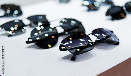 Many sunglasses are displayed in the store