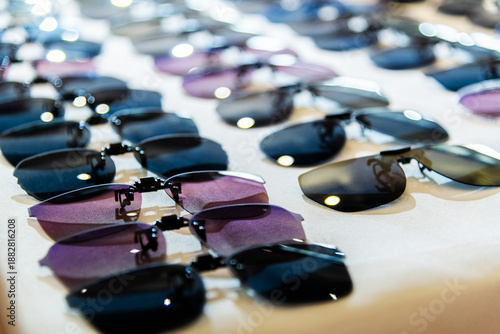 Clip sunglasses are displayed in the store
