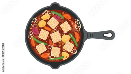 Overhead view of a delicious vegan stew simmering in a dark cast iron skillet, featuring hearty tempeh cubes, vibrant green beans, tender carrots,
