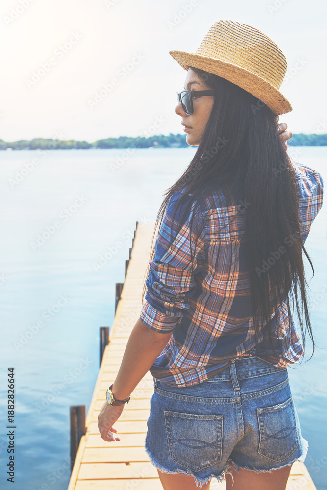 Φωτογραφία Thinking, holiday and sunglasses with woman at lake pier for summer vacation, peace and tourism