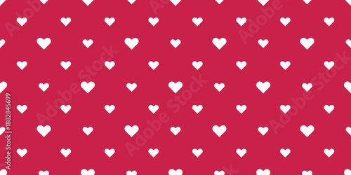 Small white hearts on raspberry red background. Romantic, delicate seamless print. Pattern for Valentines Day, weddings, and holidays
