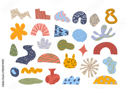 Creative collection of abstract doodle organic shapes cut out of colorful textured paper fragments