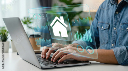 Quadro su tela Business professional using laptop with futuristic real estate data interface