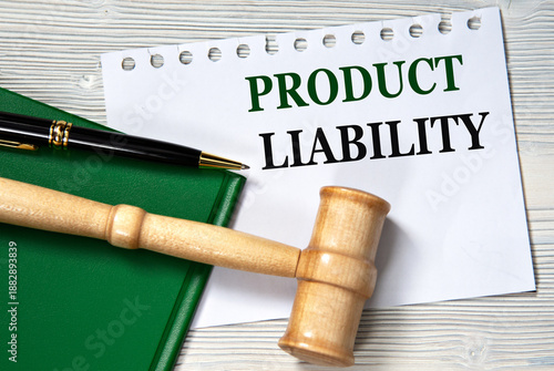 PRODUCT LIABILITY - words in white paper against the background of a green folder and a judge's gavel