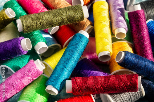 Cotton sewing thread spools, colorful bobbins for hobby craft, needlework, tailoring or embroidery