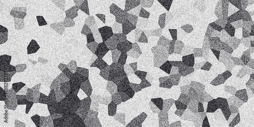 Geometric monochrome abstract pattern with irregular polygonal shapes and a speckled texture creating a mosaic-like and modern visual effect