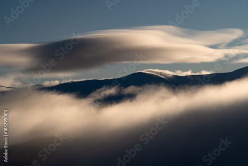 Wallpaper Mural Cloud formations drift over mountain peaks during early morning hours in a rural area. Winter Hiking in Carpathian Mountains, Ukraine Torontodigital.ca