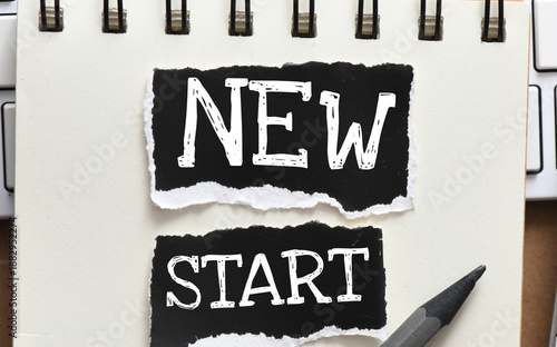 Wallpaper Mural NEW START words on small black sheets of paper. Torontodigital.ca