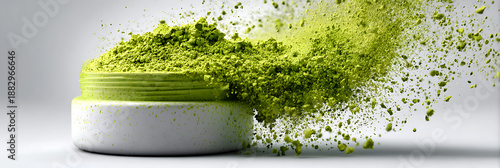 Dynamic explosion of vibrant green matcha tea powder scattering dramatically from a white ceramic jar against a pristine studio background.