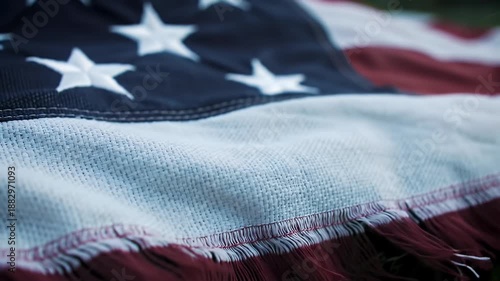 Worn American Flag With Frayed Edges And White Stars On Blue Field And Red Stripes Close Up