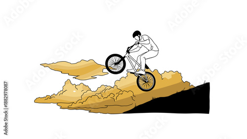 Mountain biker performing stunt in golden cloudscape