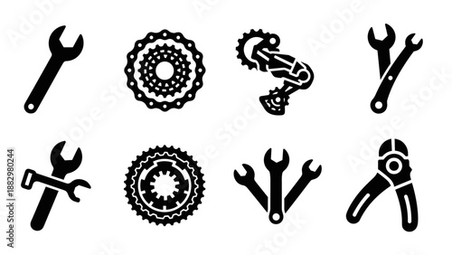 Set of black silhouette bicycle repair tools and gears on white background