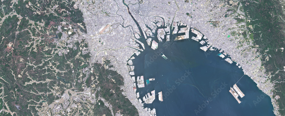 Obraz premium Osaka Bay and Coastal Urban Area in Japan Viewed from Space – Ports, Industry and Coastline in Satellite Imagery